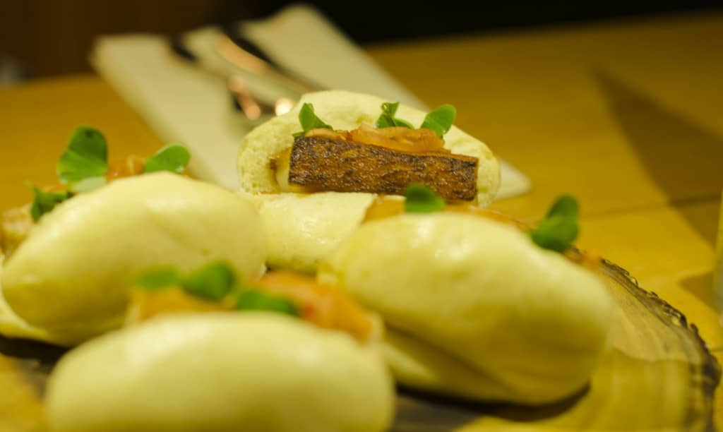 Pork bao buns served as part of a selction of starters