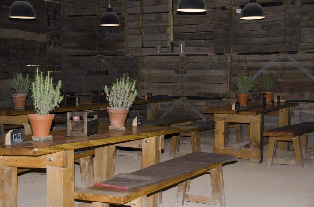 Rustic seating with sand floor to add to the atmosphere