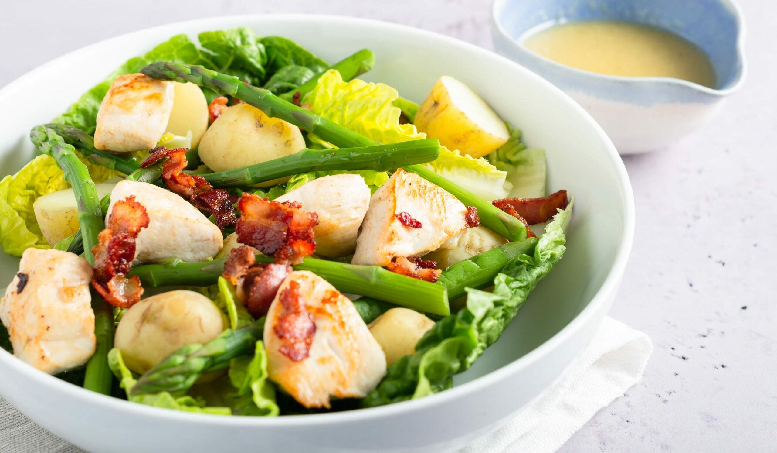 A fresh salas of grilled chicken, asparagus, bacon and new jersey royal potatoes