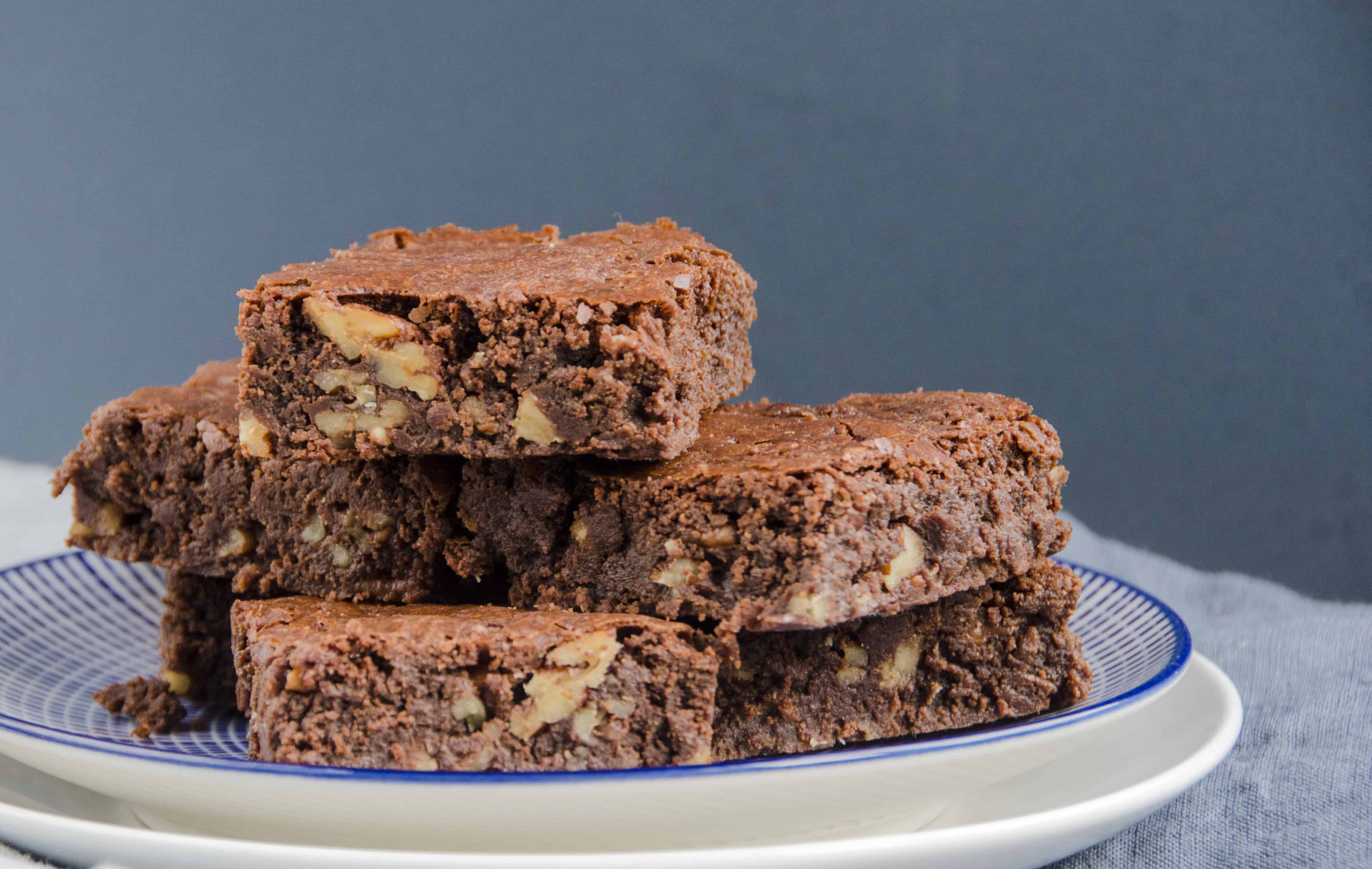 chewy chocolate and pecan brownies from a side view to see the nuts