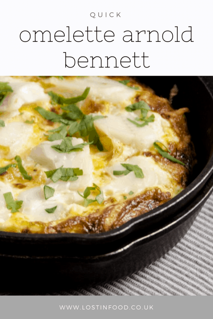 Pinterest image of Omelette Arnold Bennett in a black fry pan.