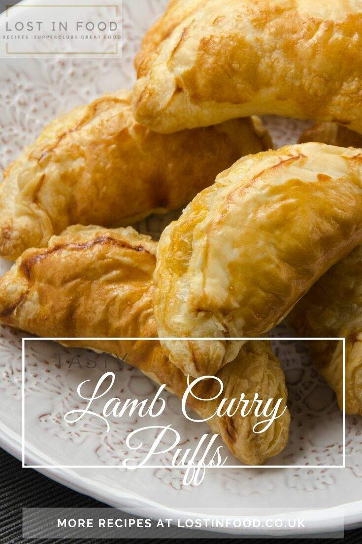 An image of curry puffs baked on a white plate and overlaid with text that reads Lamb Curry Puffs