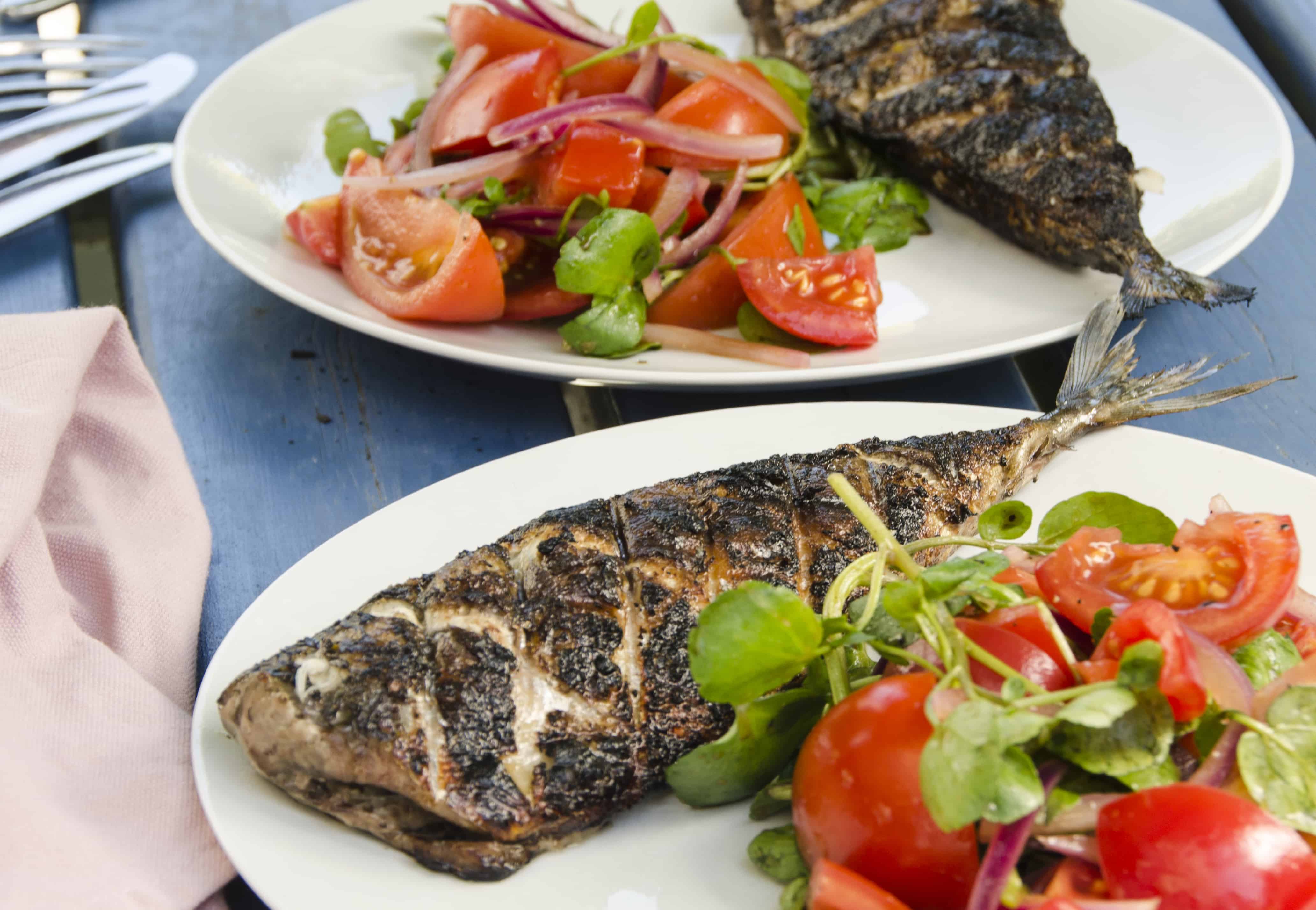 BBQ devilled mackerel with a tomato, red onion and watercress salad.