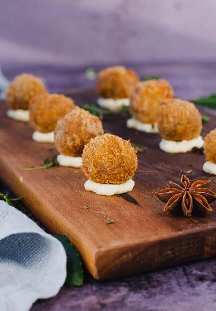 pork bon bons on a wooden board