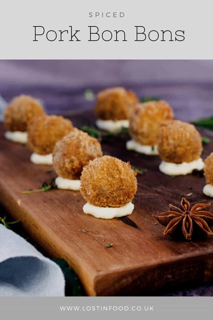 spiced pork bon bons on a wooden chopping board