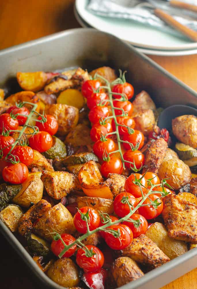 cajun chicken one pot dish ready to serve with plates ready in the background