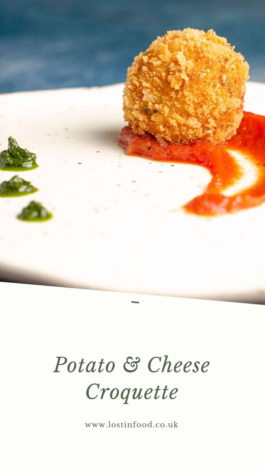 A crumbed potato and cheese croquette served with a swirl of rich tomato sauce.