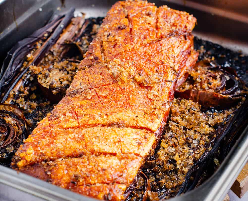 A large piece of boneless pork belly direct from the oven with extra crisp crackling.