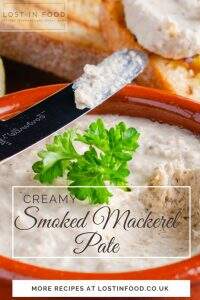 a closeup view of a dish of smoked mackerel pate garnished with parsley with a bone handle knife taking a first dip and overlaid with text naming the dish