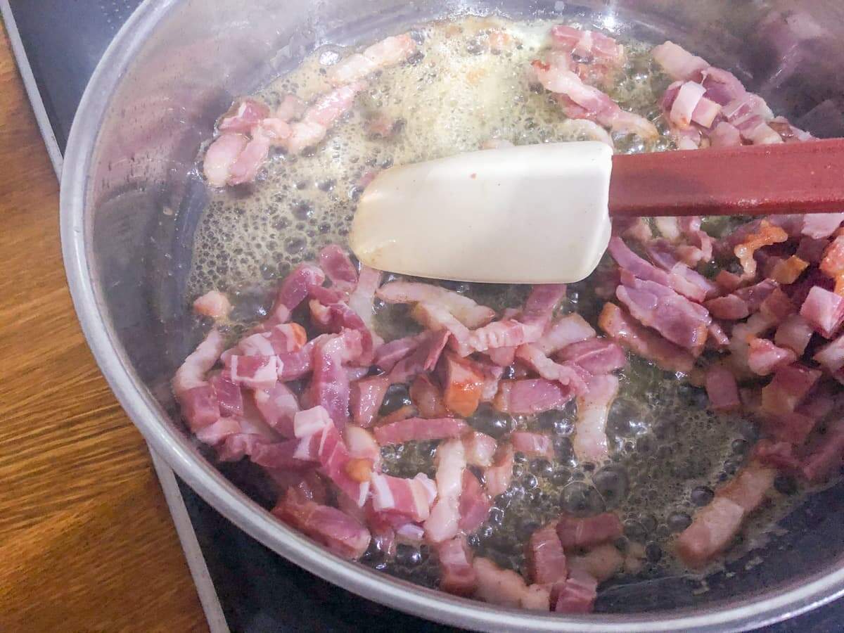 Pan frying chopped pancetta to start a bulgar wheat risotto.