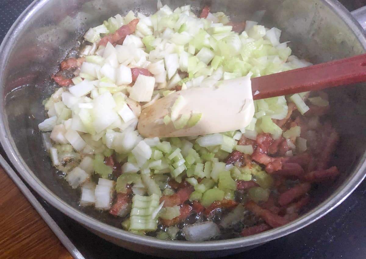 Sautéing diced onion, celery and bacon to start making a bulgar wheat risotto.