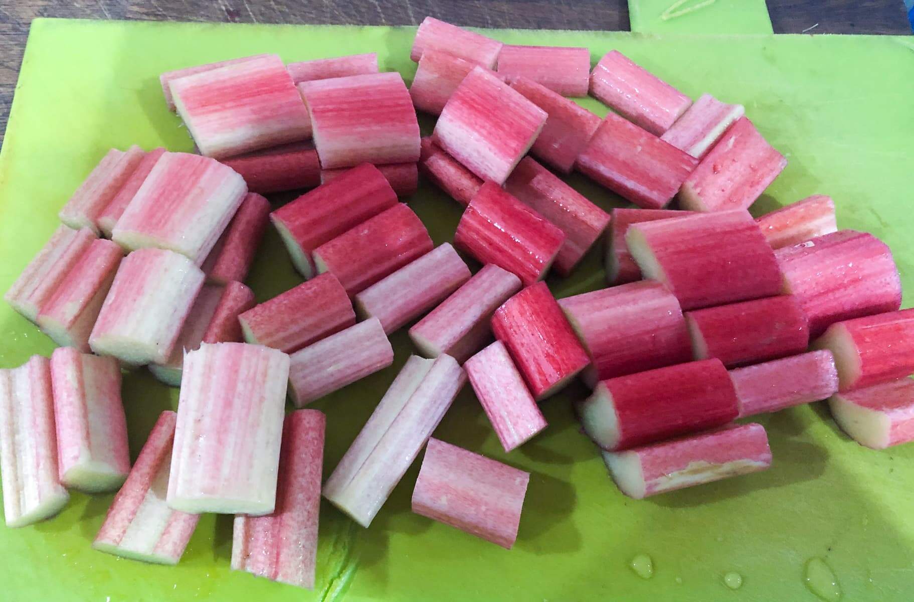 Step by step of making rhubarb crumble - rhubarb washed and chopped into small pieces.