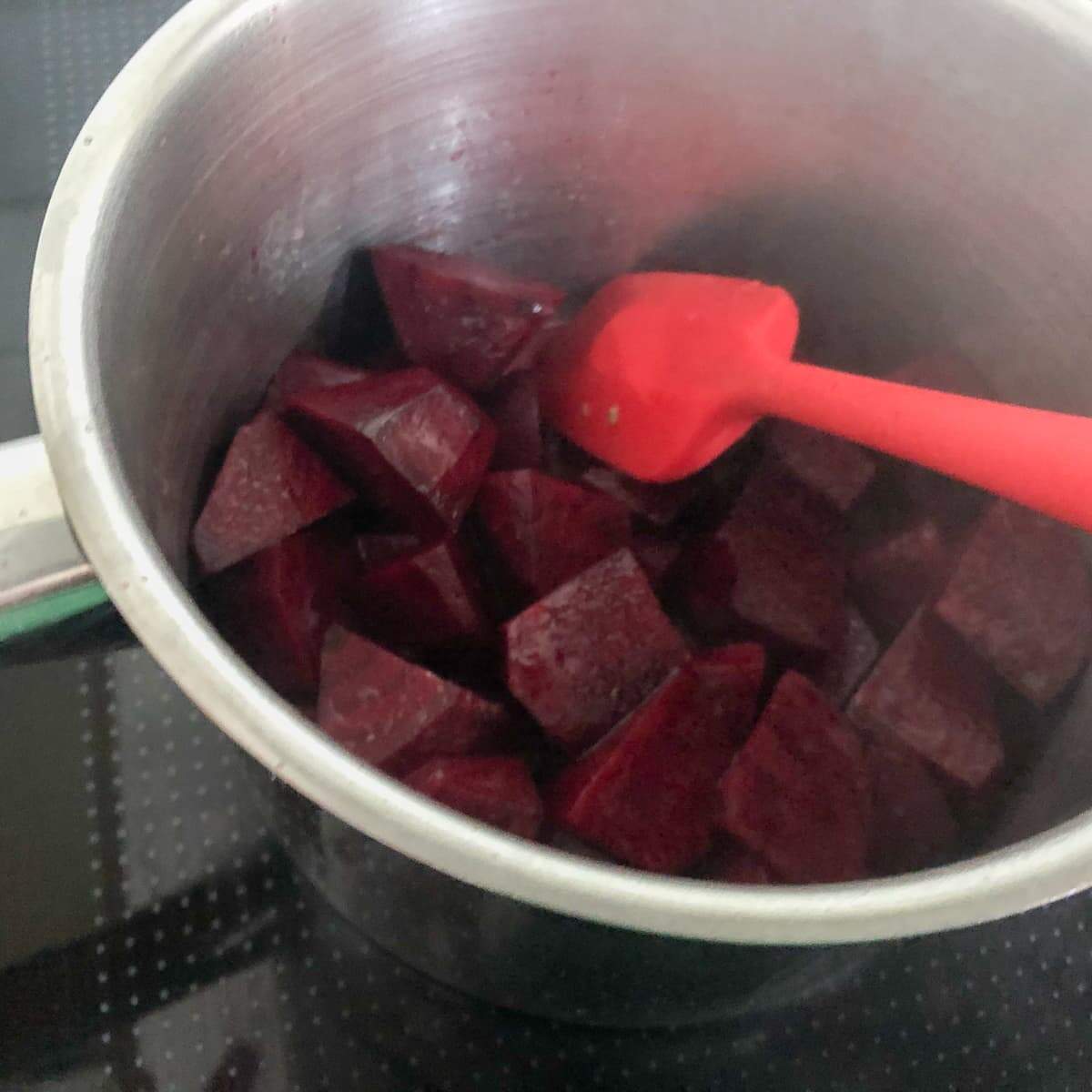 Chopped beetroot cooking in a pan