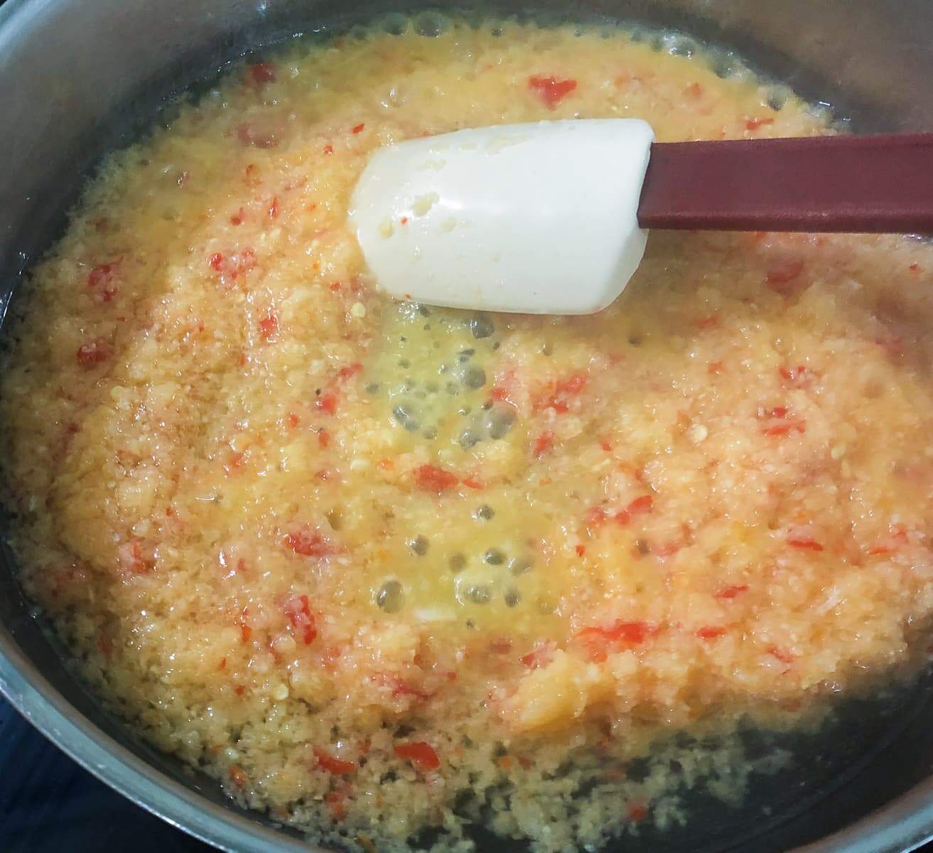 Frying off onions, garlic, ginger and chilli paste.