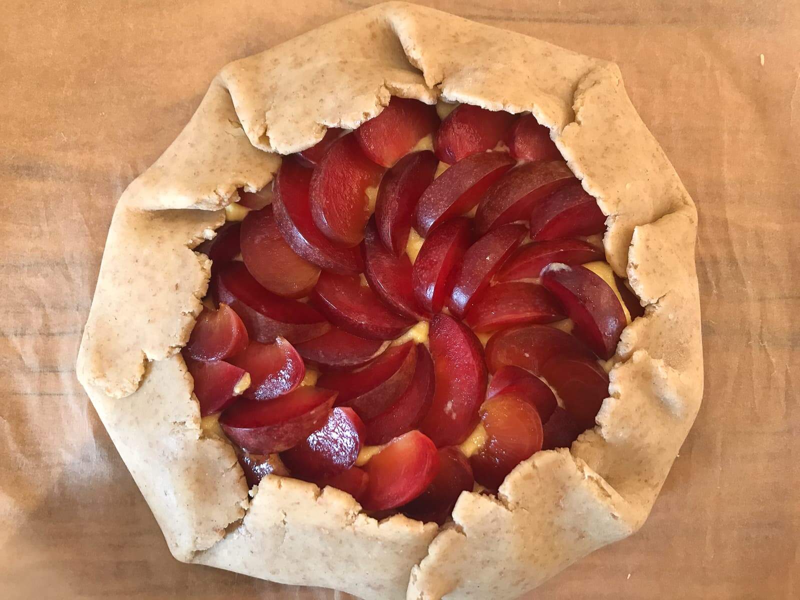 A plum galette about to go into the oven.