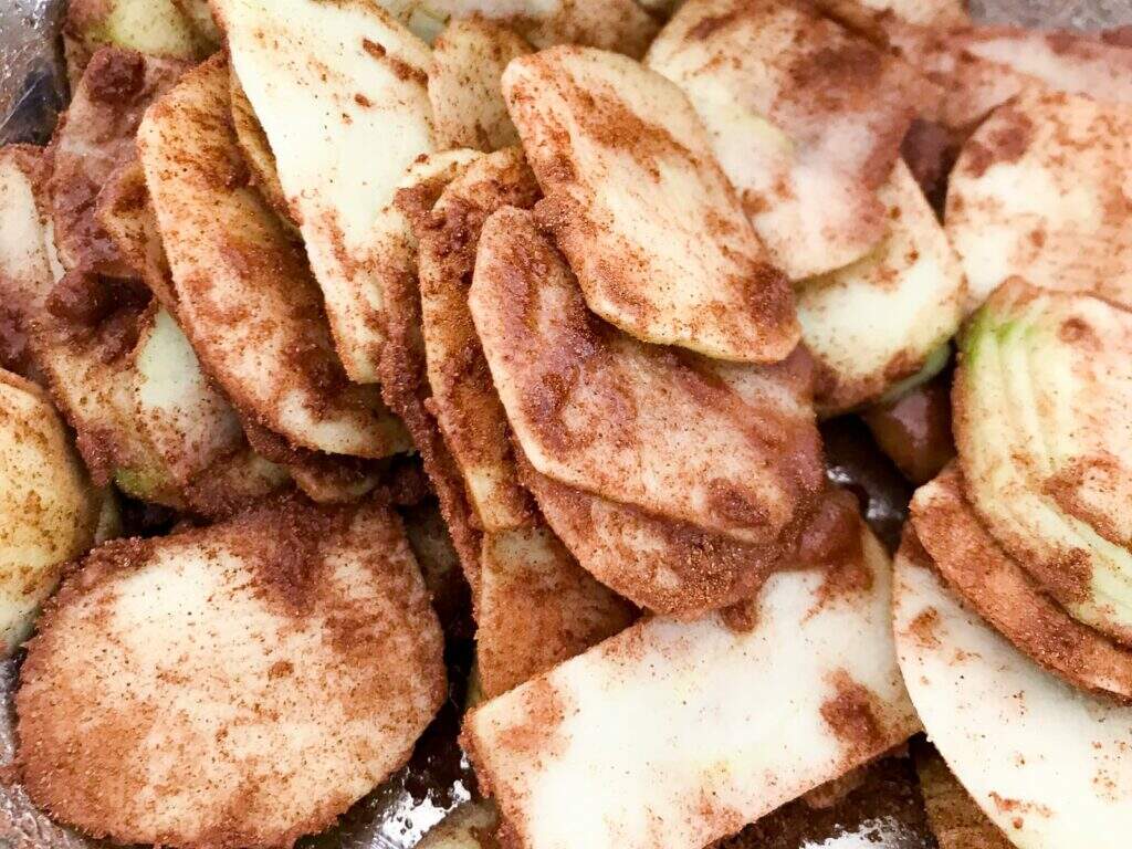 Sliced apples tossed in cinnamon sugar.