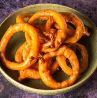 A bowl of freshly cooked crispy onion rings