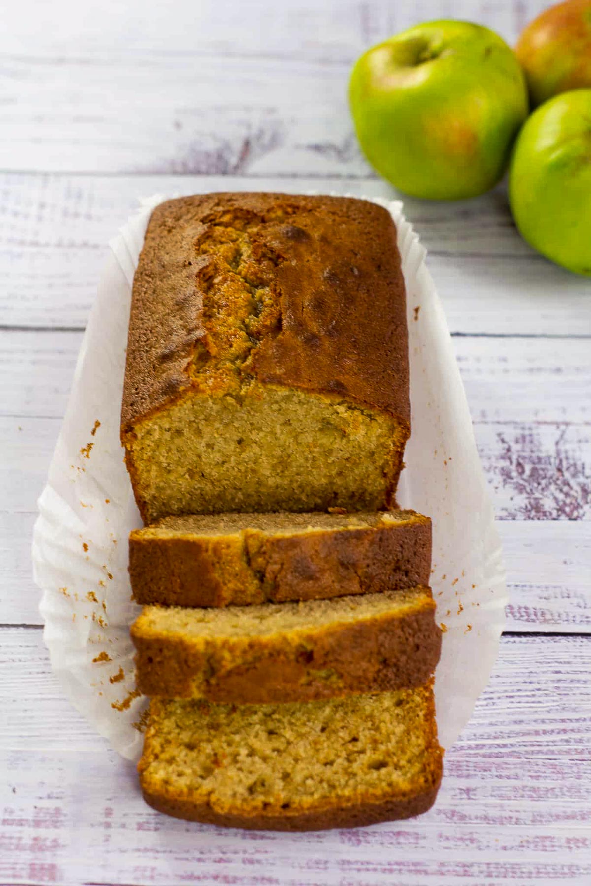Apple loaf cake with a few slices from Apply to Face Blog.