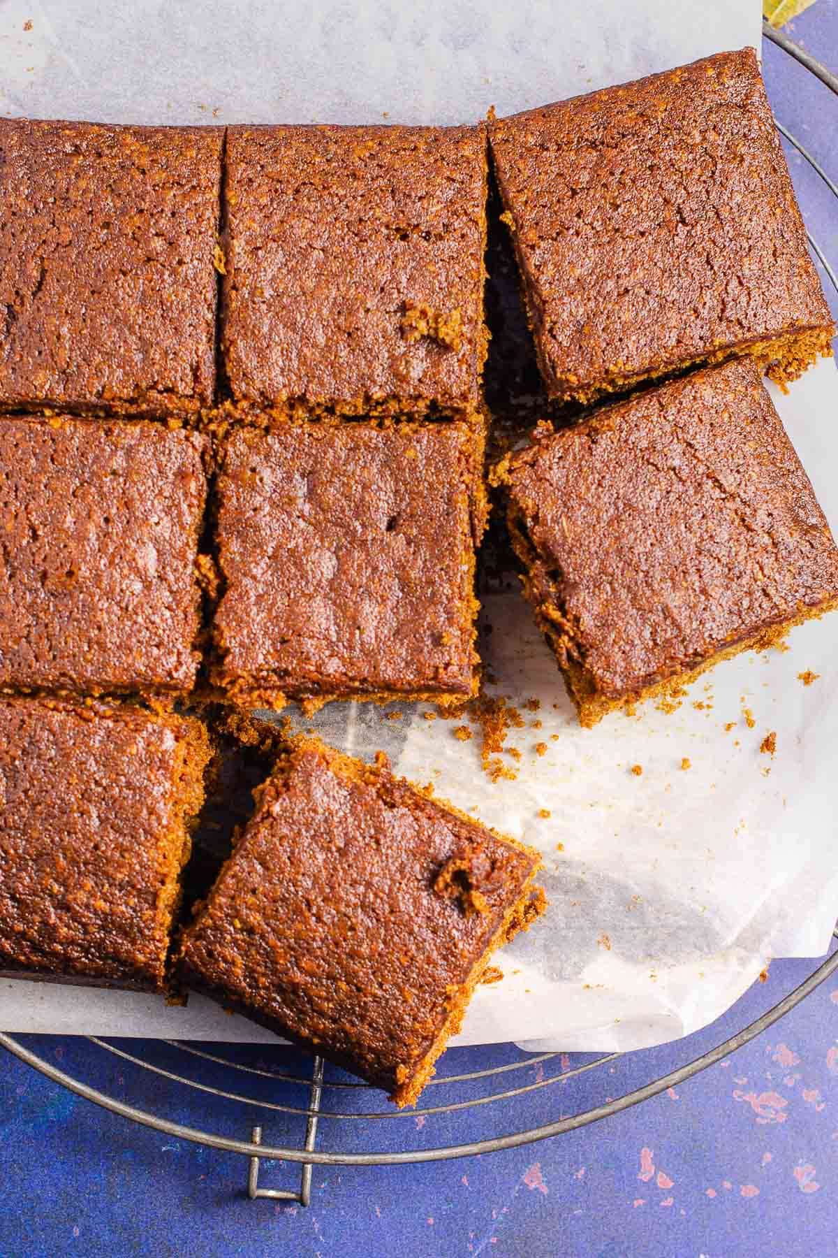 A Yorkshire parkin cut into squares on a cooling rack.