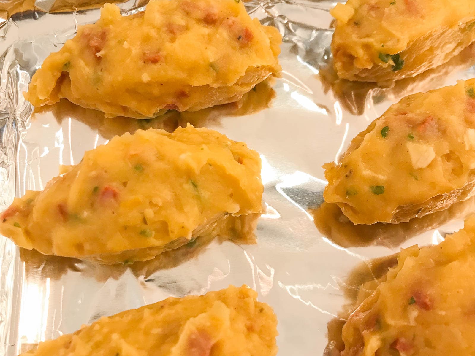 Quenelles of chicken and chorizo croquettes before being rolled in breadcrumbs.