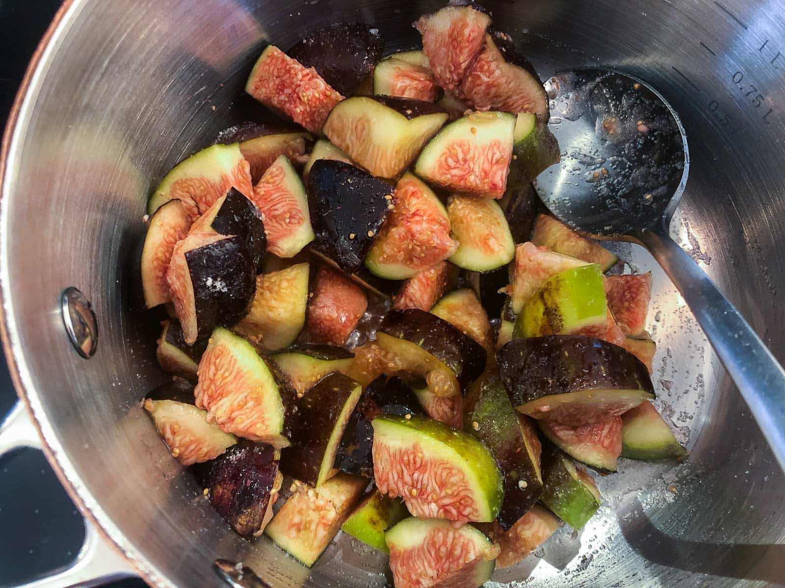 figs diced in a pan to make a fig compote.