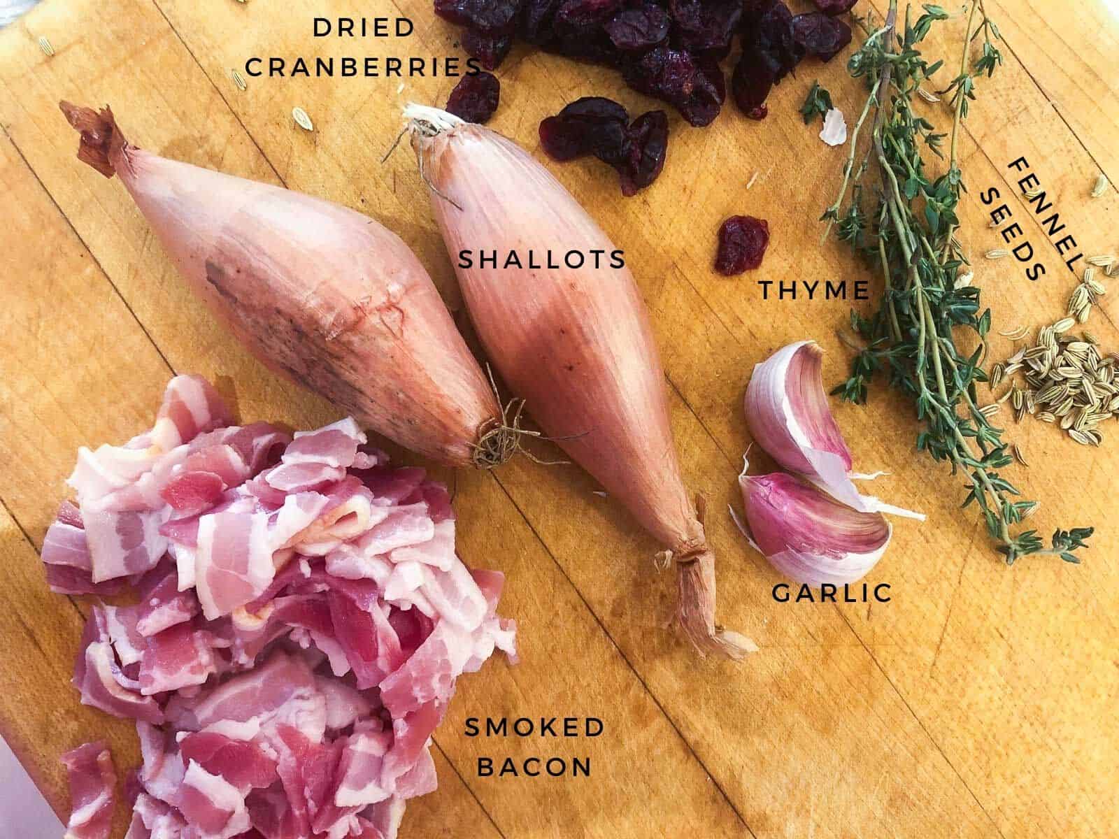 Ingredients on a chopping board with labels on them.