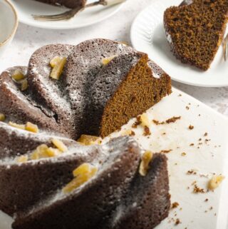 a bundt cake cut into servings and served on white plates