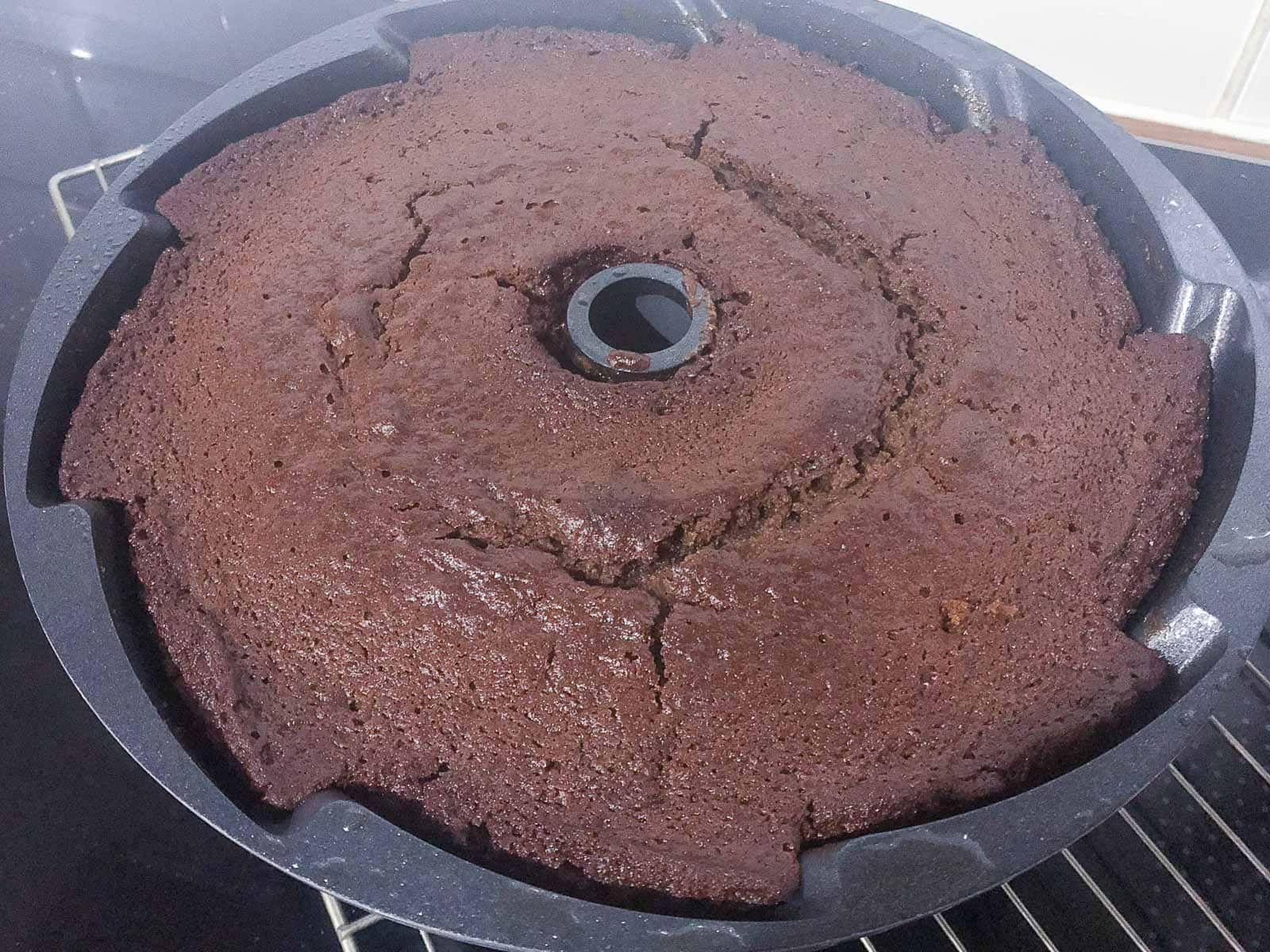 A cake in a bundt tin fresh from the oven.