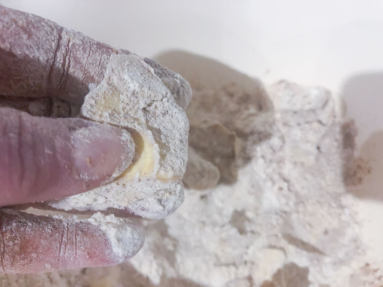 Showing how to rub butter through flour to get a fine crumb texture