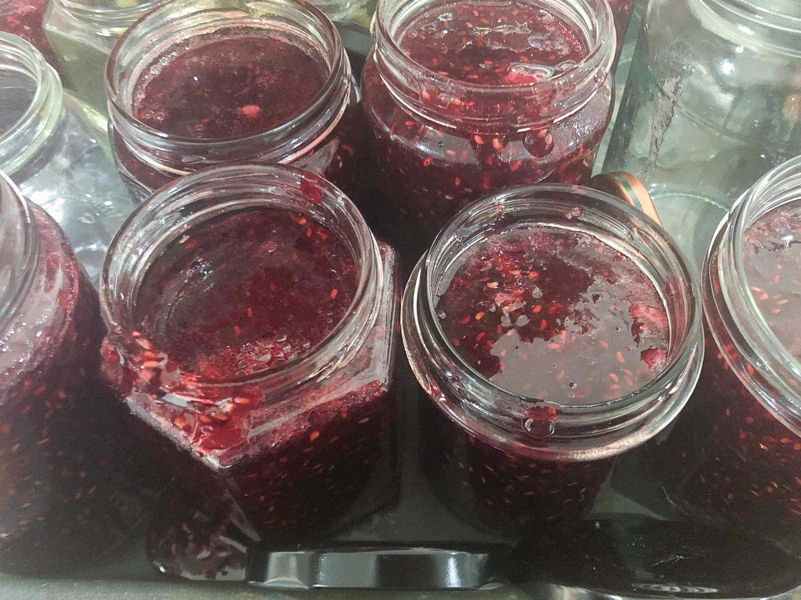 Warm jam in sterilised jars before the lids being added.