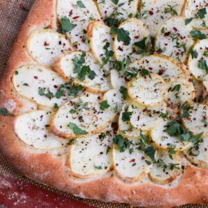 Oven baked potato galette with fresh herbs just out of the oven.