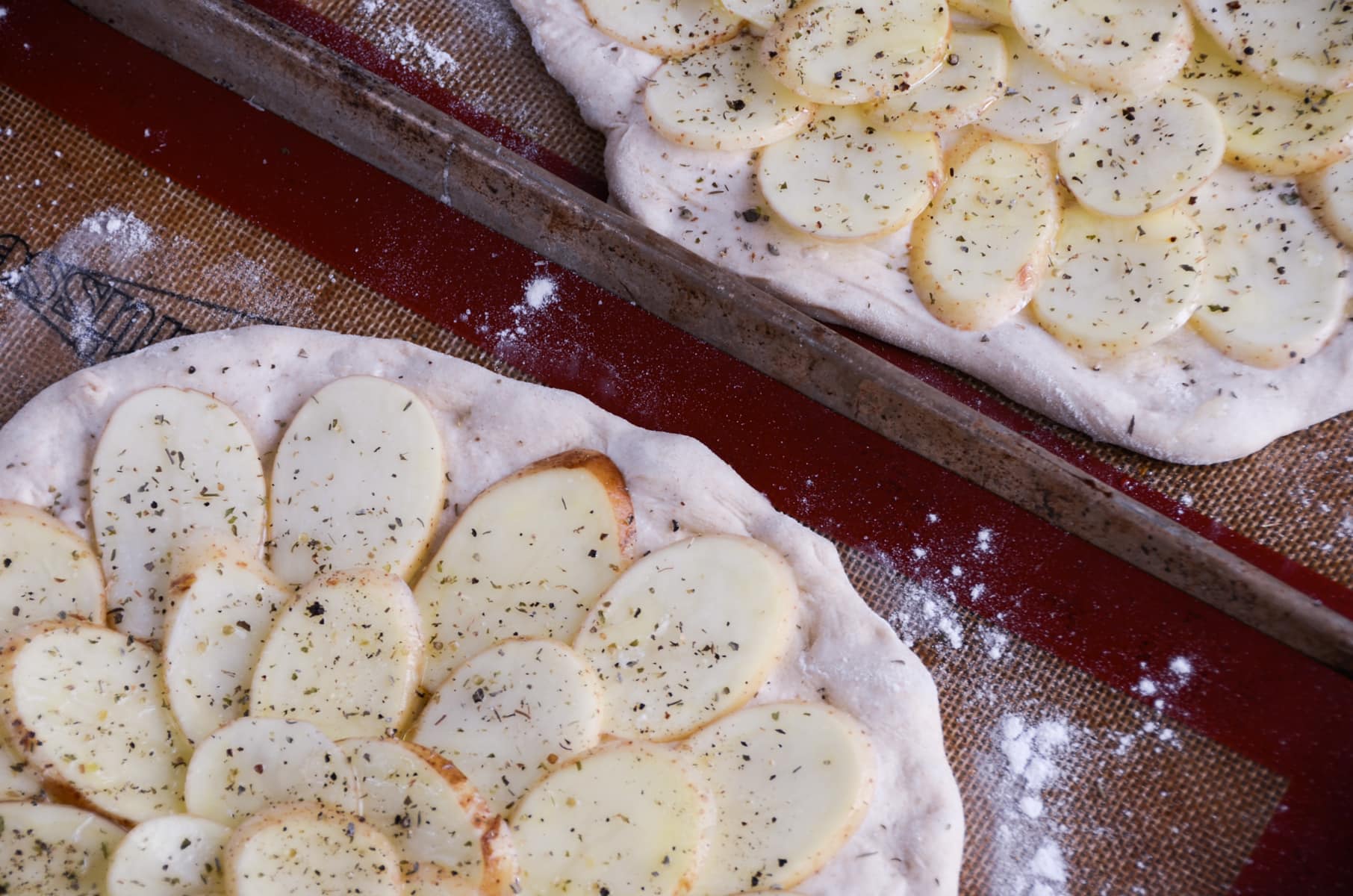 2 large potato galettes ready for the oven to be baked.