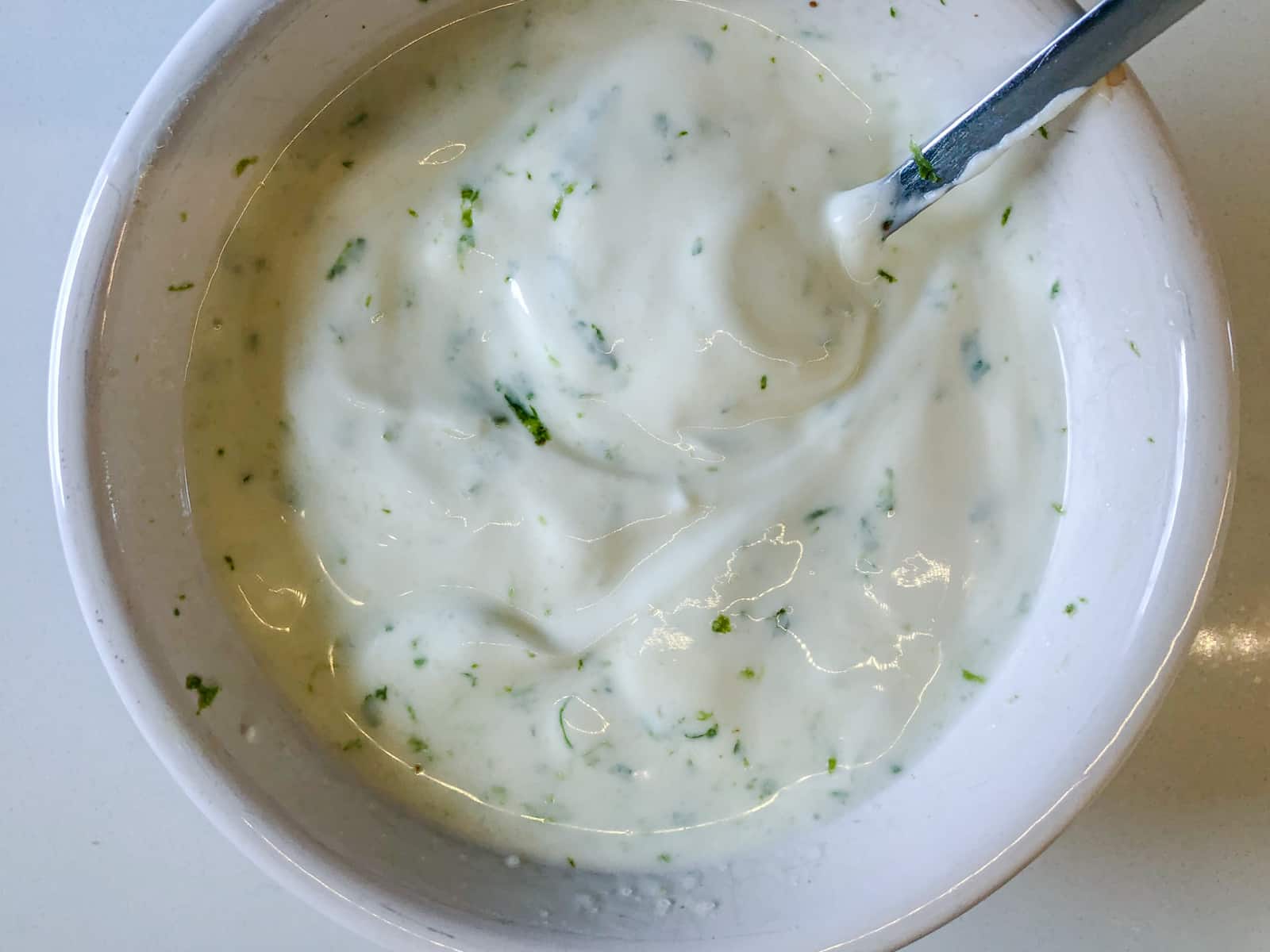 Lime cream in a white bowl.