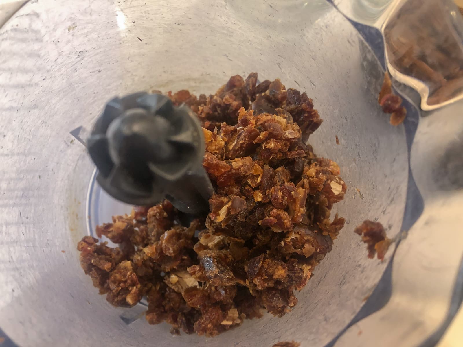 Whole pitted dates finely diced in a small hand chopper.