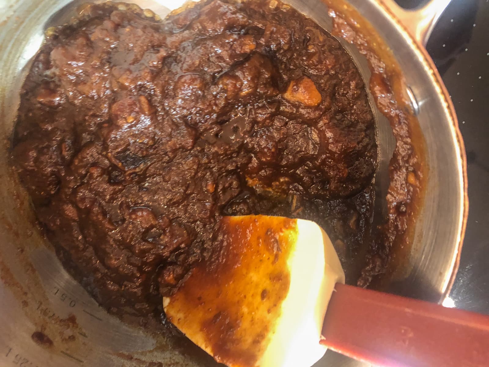 Cooking dates and tamarind paste with sugar and spices to make a quick chutney.
