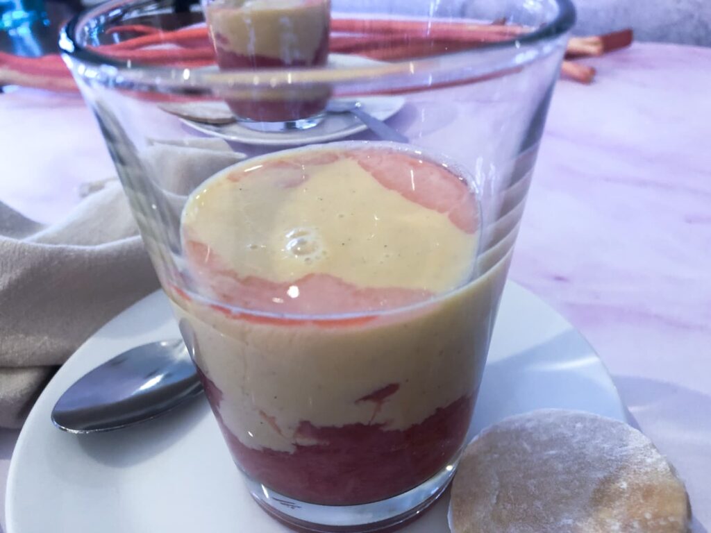 Layers of rhubarb and custard in a glass.