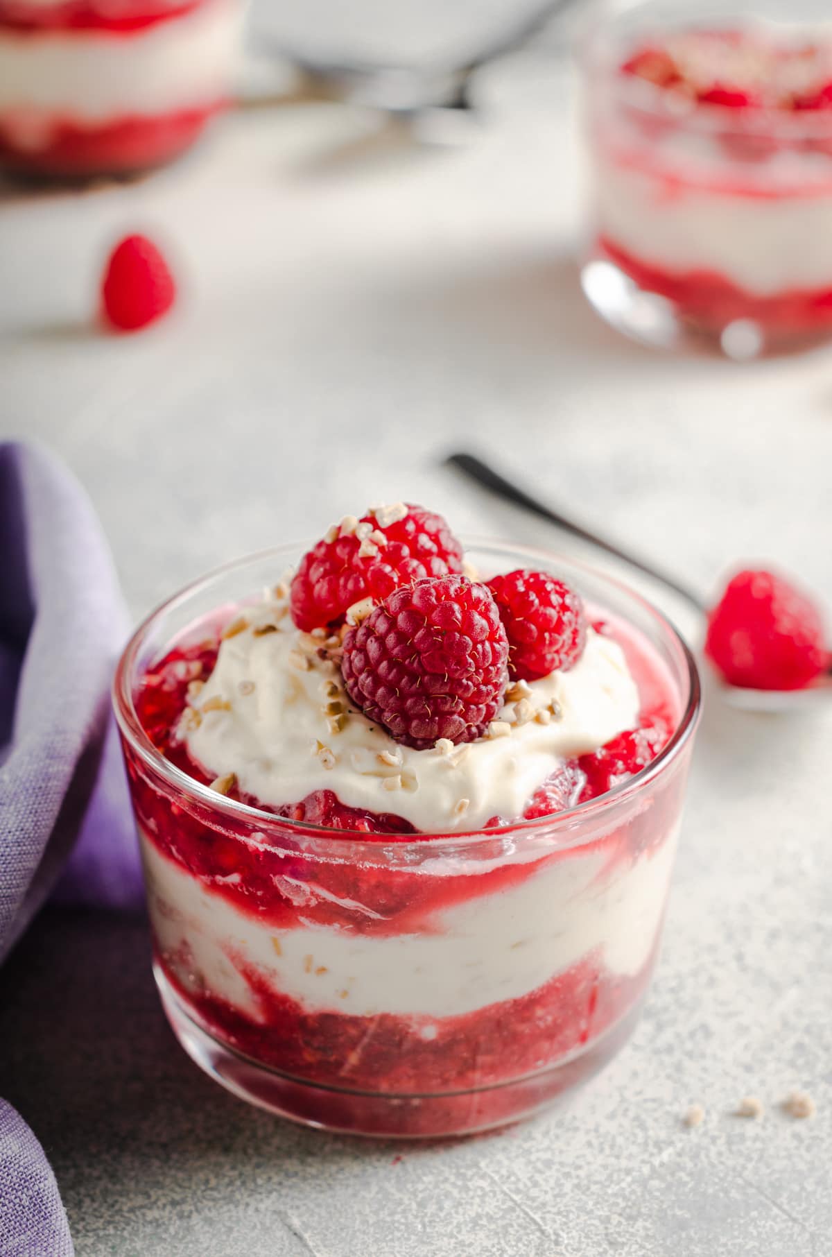 A Scottish Traditional Cranachan layered in a glass serving dish, made with fresh Scottish raspberries, toasted Scottish pinhead oatmeal, and whipped cream with whisky and heather honey.