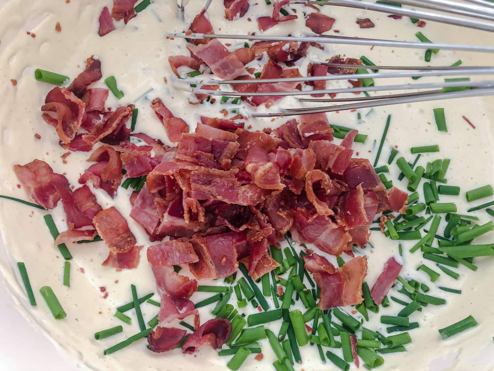 Bacon and chives added into a creamy dressing.