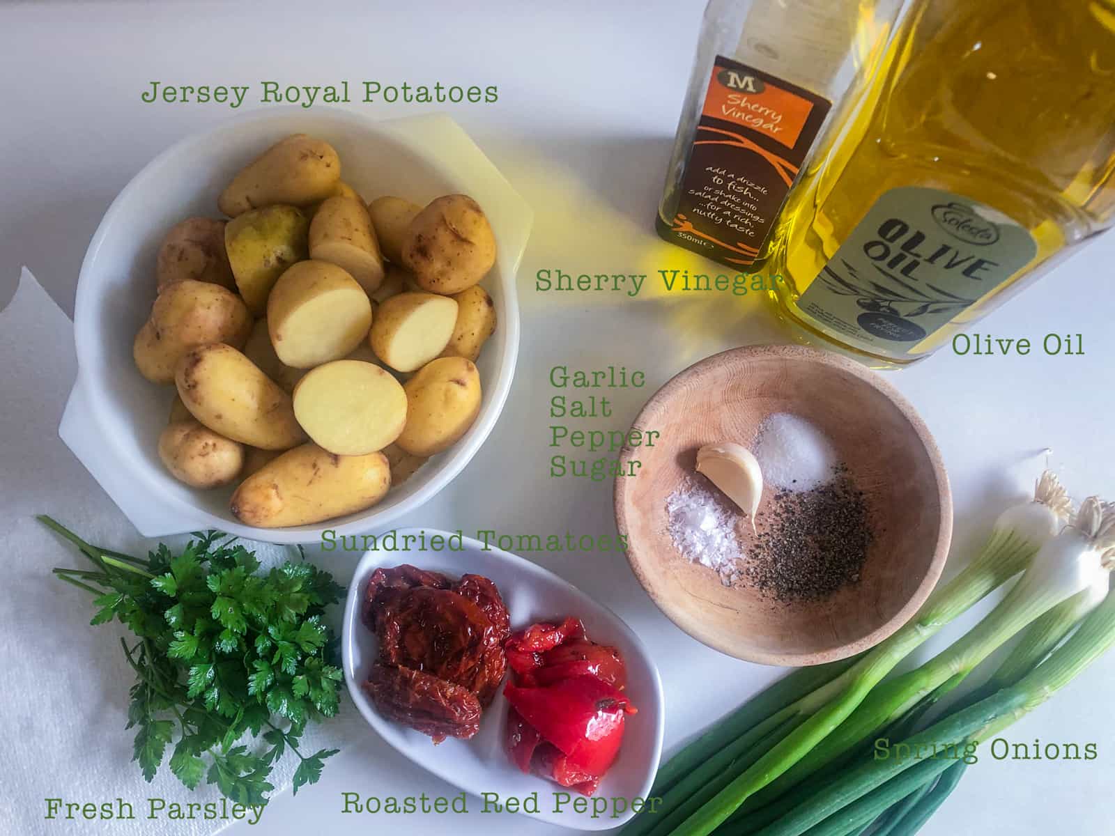 Ingredients laid out and labelled for a vegan potato salad.