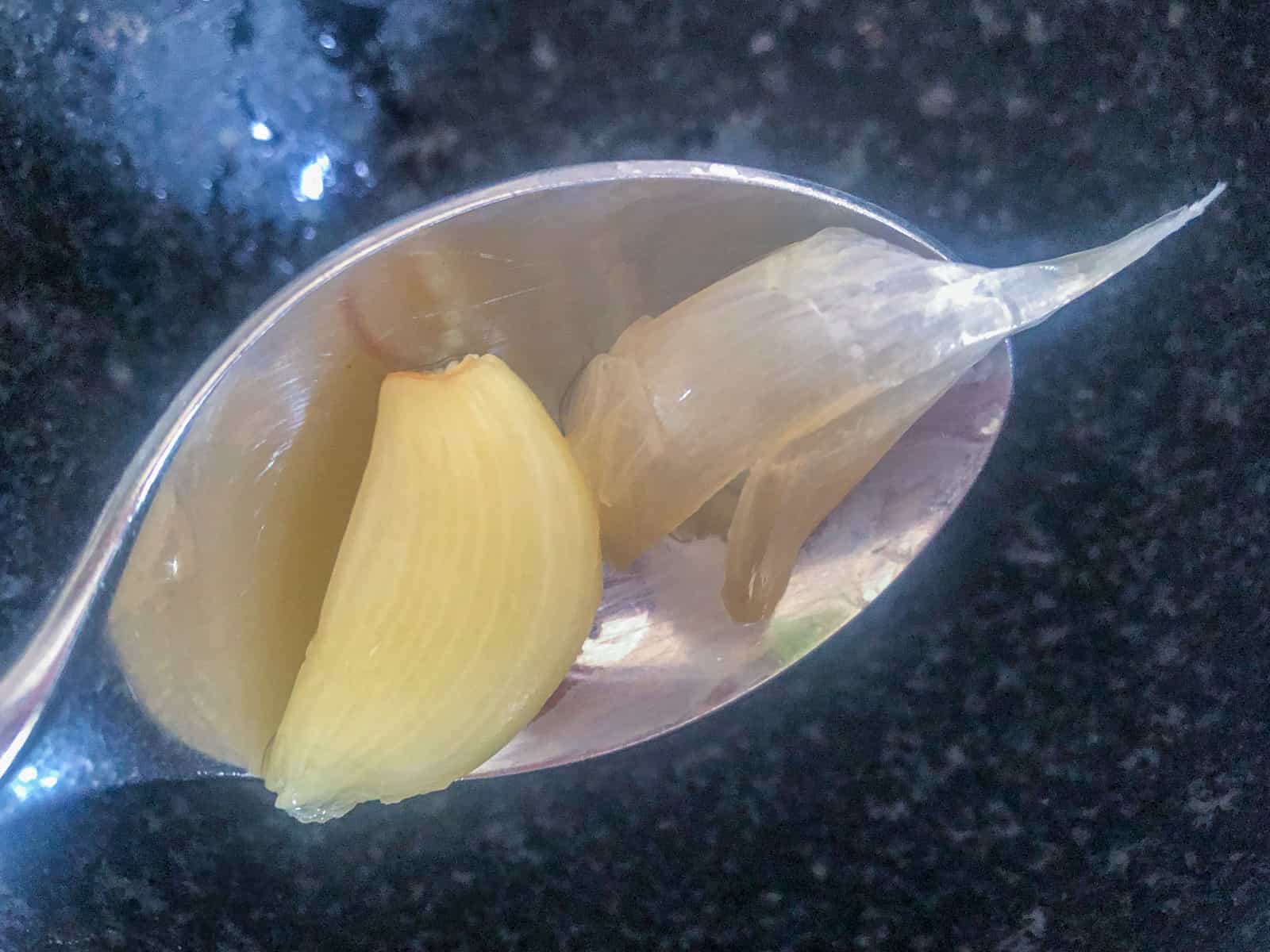 A garlic clove removed from its skin.