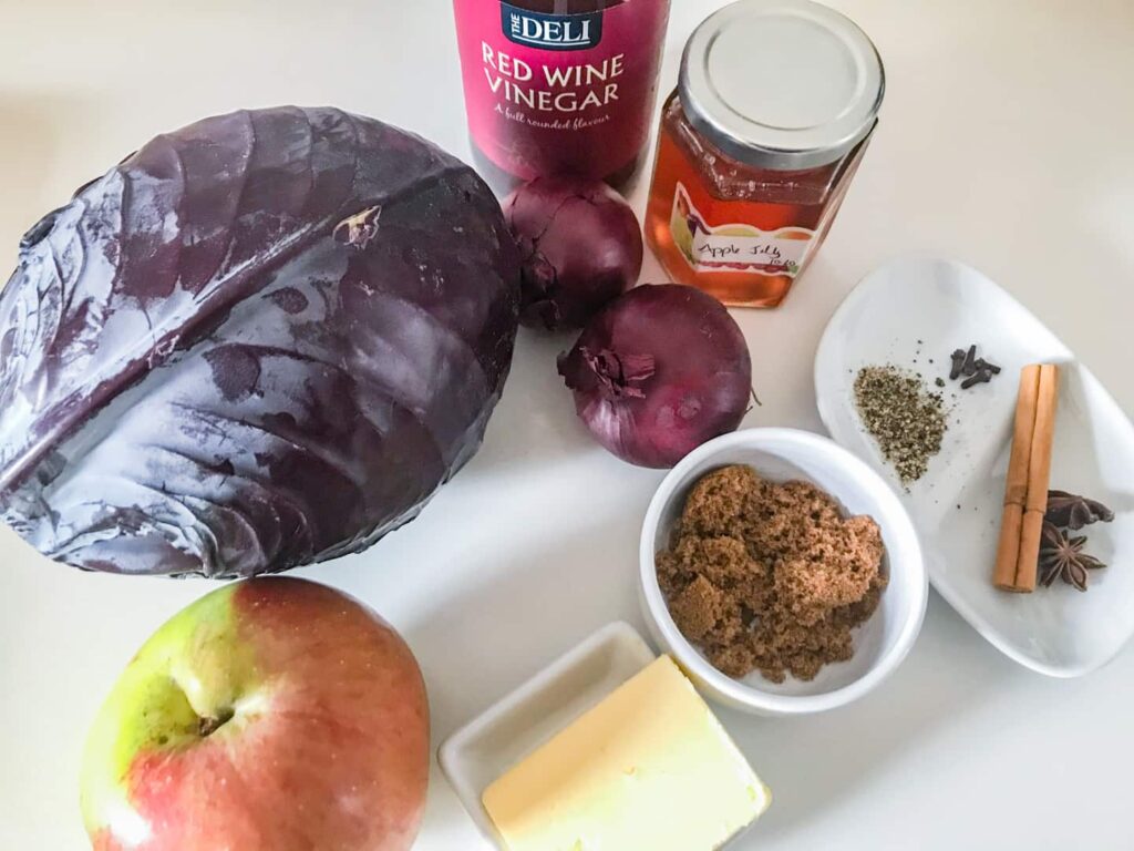 Ingredients to make a spiced cooked red cabbage dish.