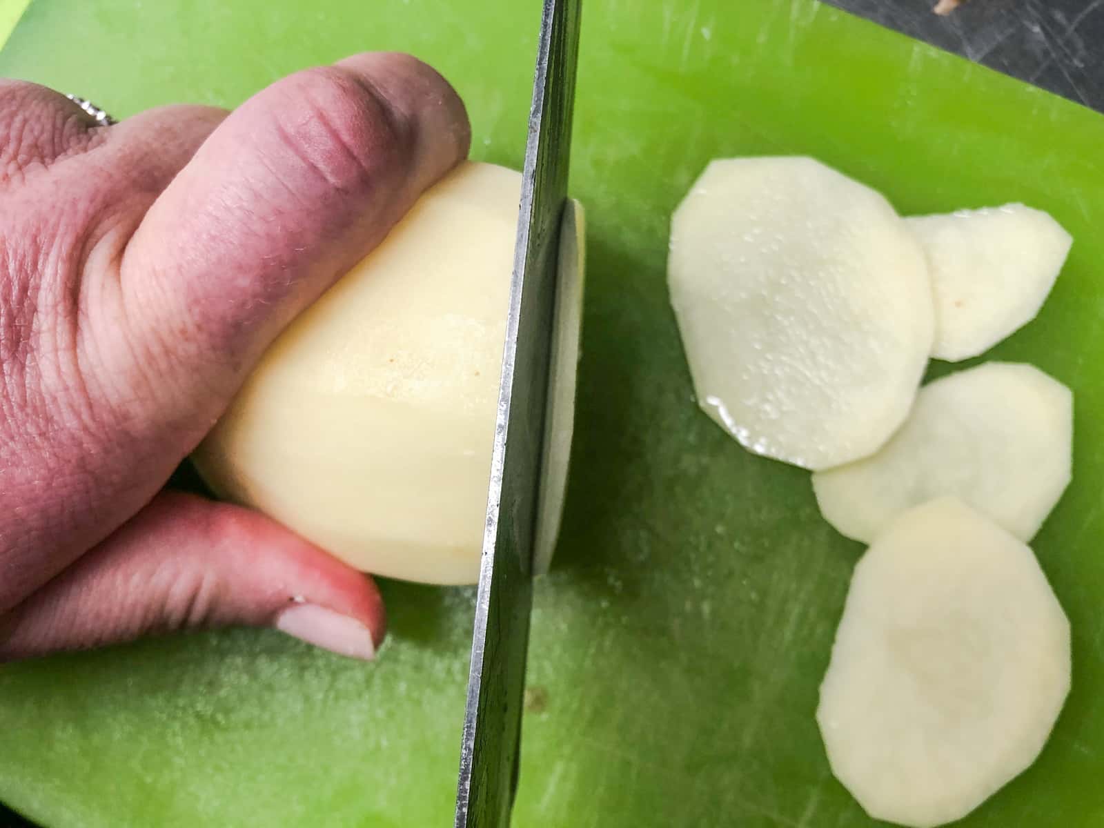Slicing potatoes for a layered side dish.