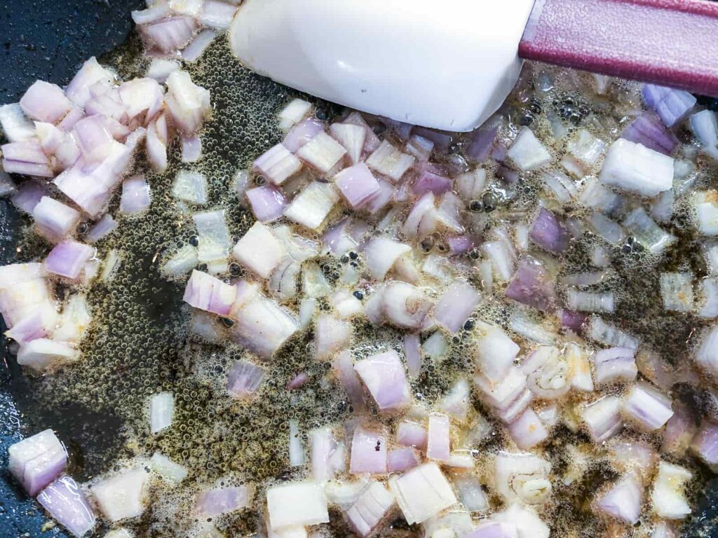 Diced shallots gently frying in butter.