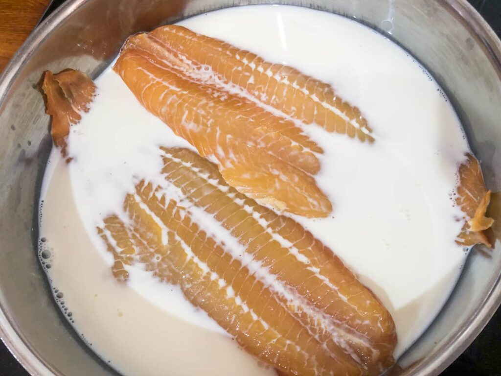 Fillets of lightly smoked haddock gently poaching in milk.