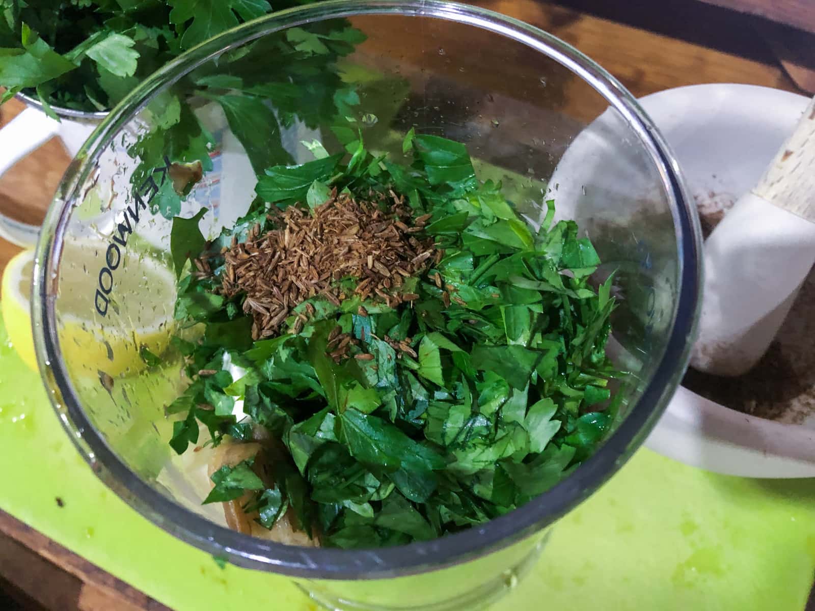 Spices, chopped parsley and cooked aubergine in a blender to make a smooth dip.