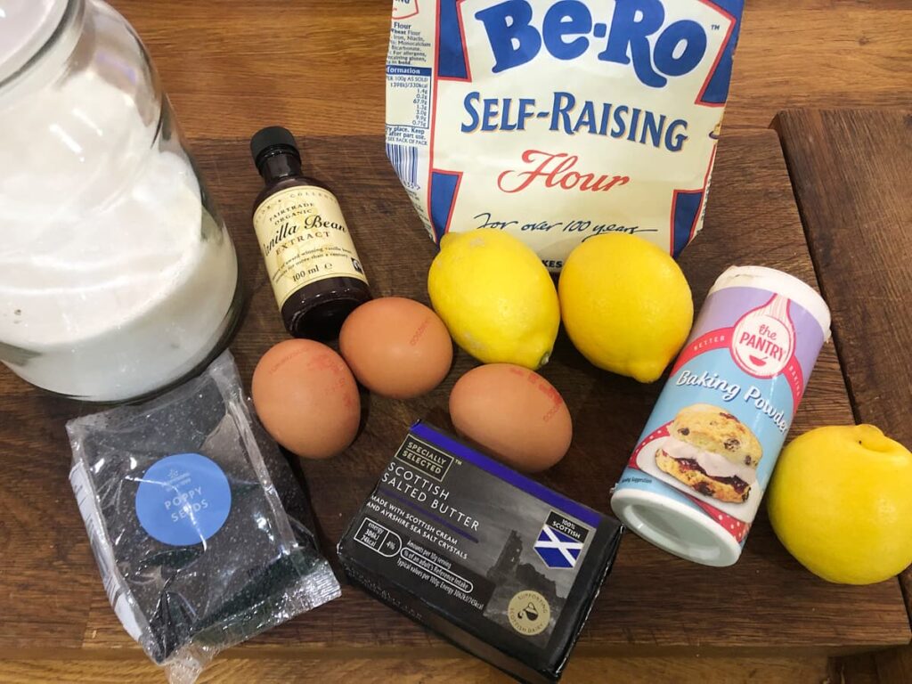 Ingredients to make a lemon and poppy seed cake.