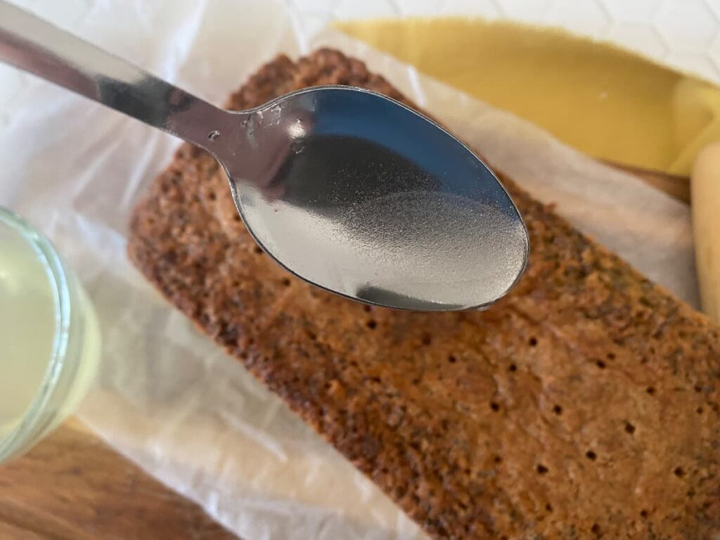 Drizzling over a lemon and sugar mix to a cake with small holes poked in to allow the syrup to absorb.