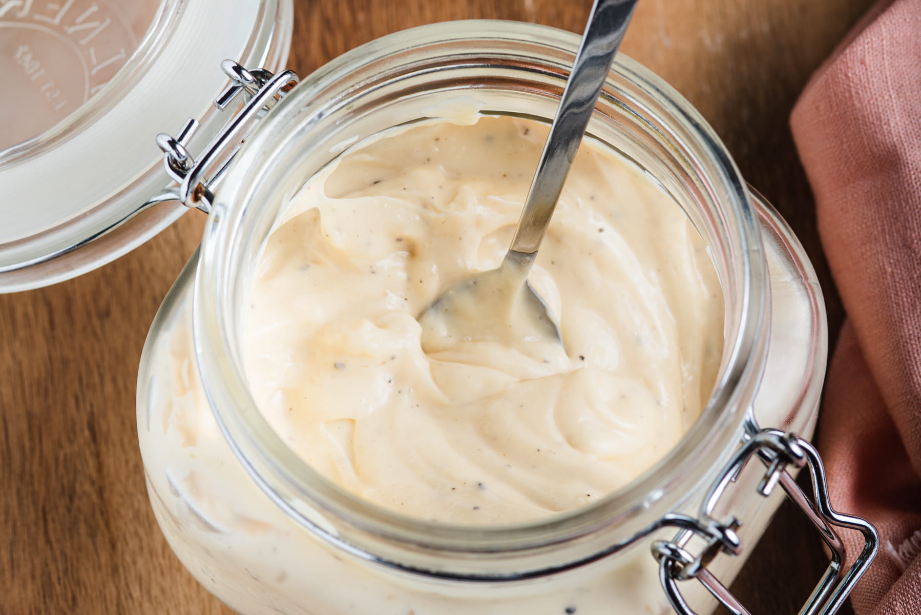 Thick and creamy homemade mayonnaise in a Kilner jar.