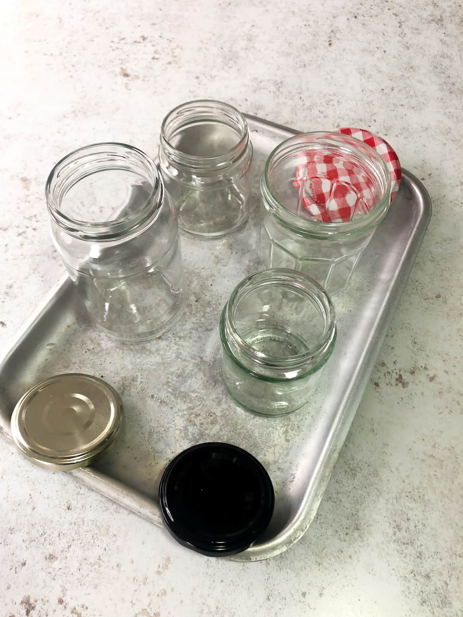 Tray filled with 4 glass jars and lids