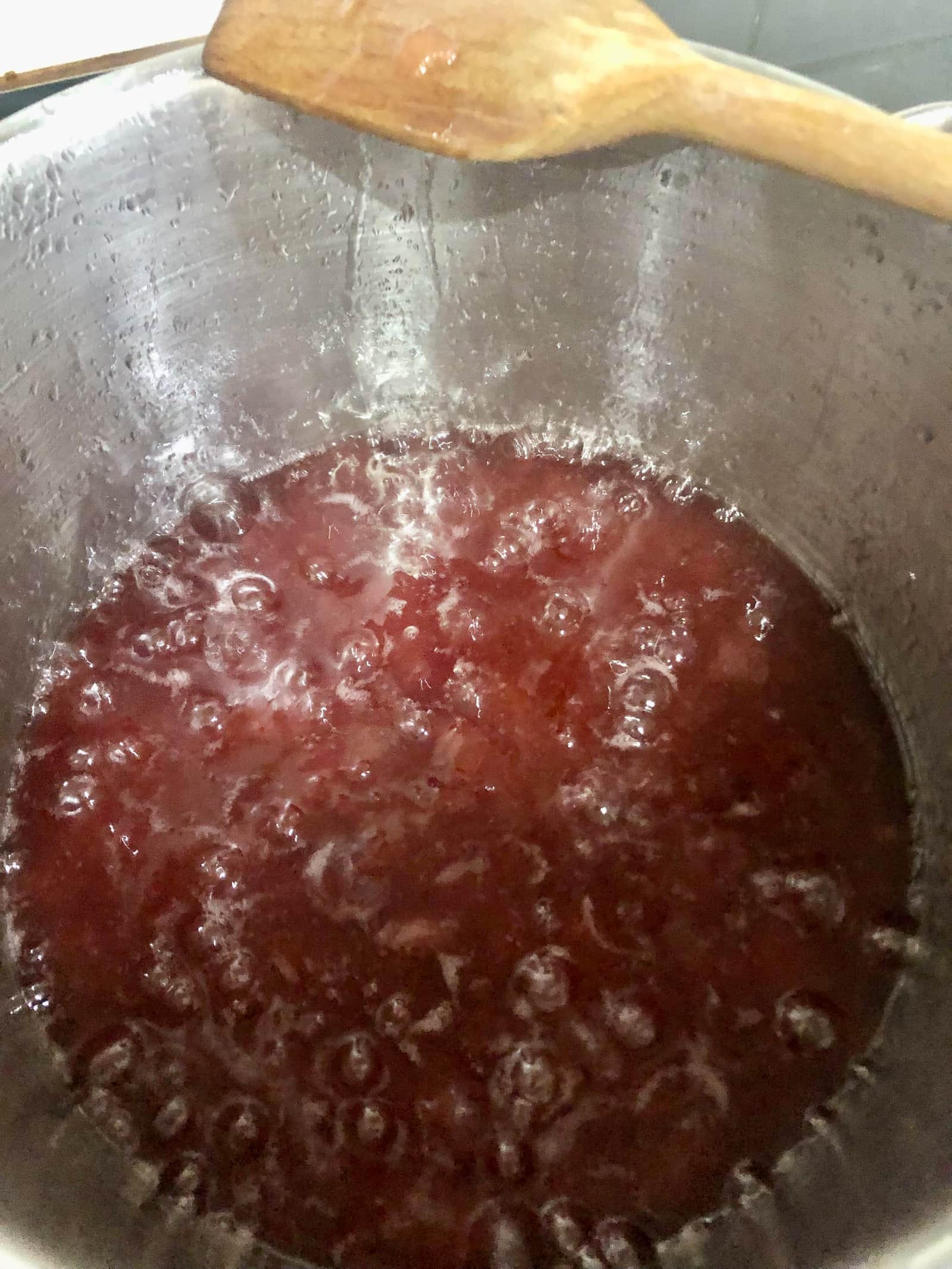 Rhubarb and ginger jam being boiled in a large saucepan